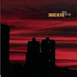 SMOKE OR FIRE  ABOVE THE CITY  - CD